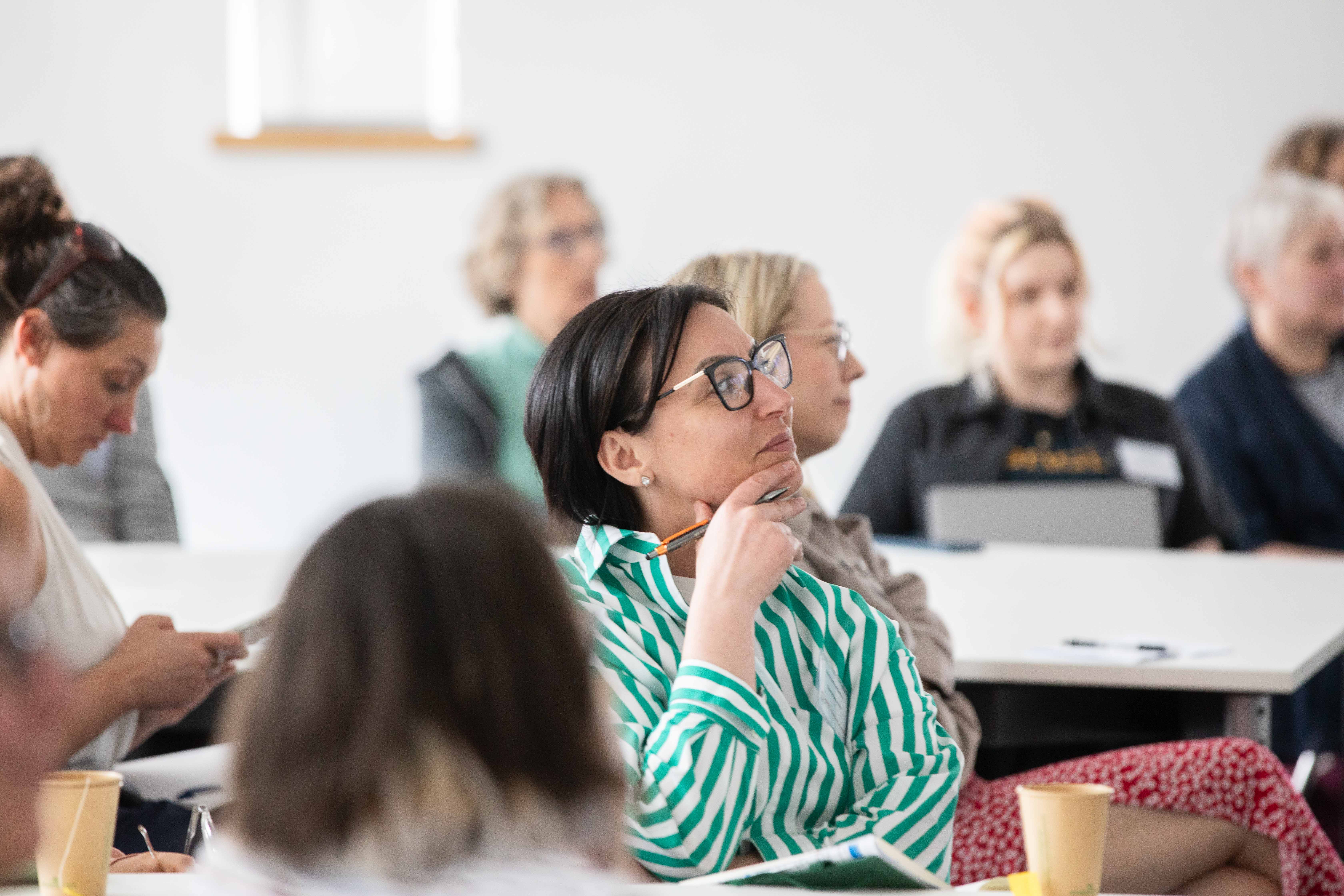 A CEO from the workshop watches intently