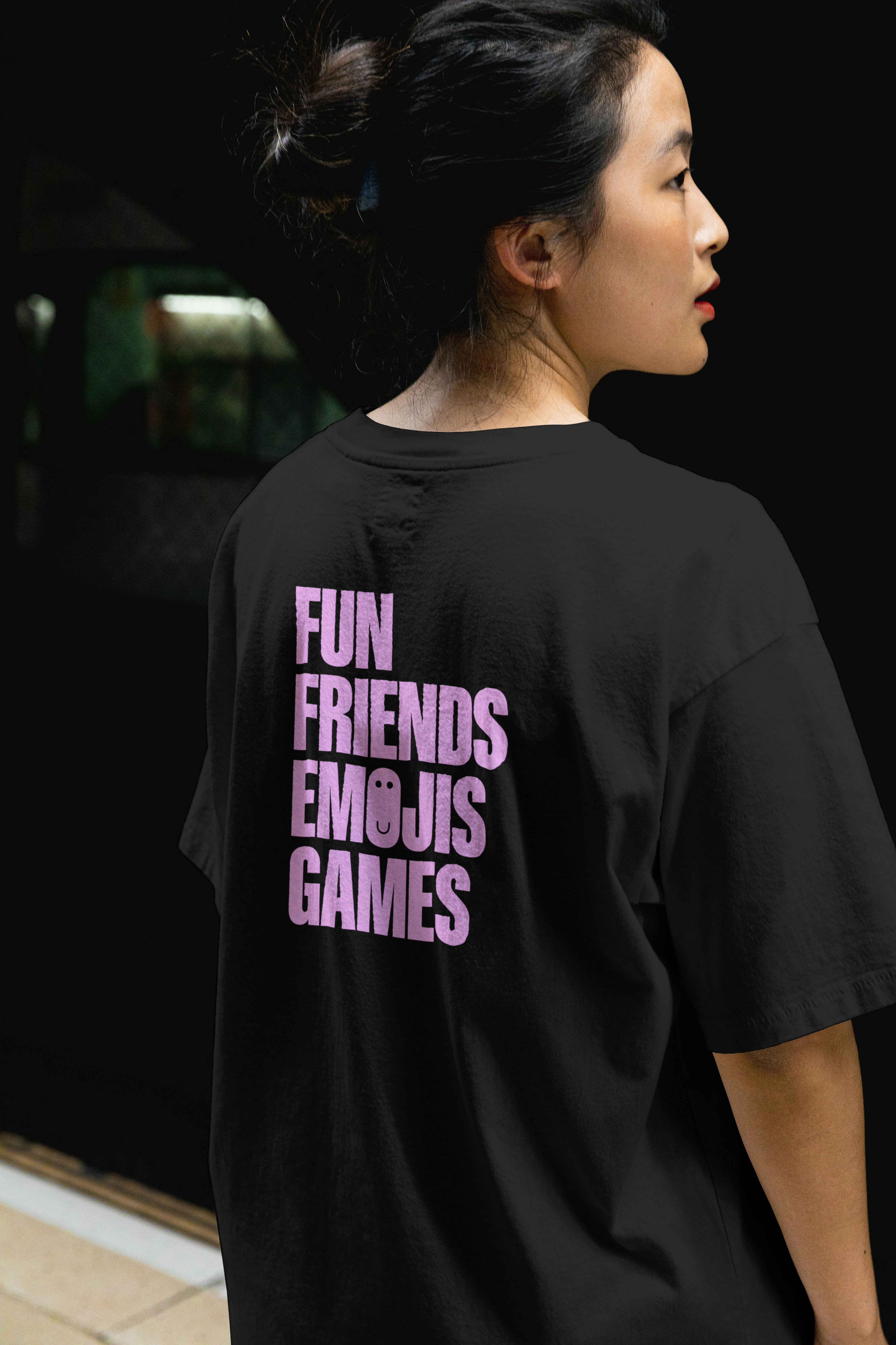 A back of a branded GTTG T-shirt states 'Fun Friends Emojis Games'